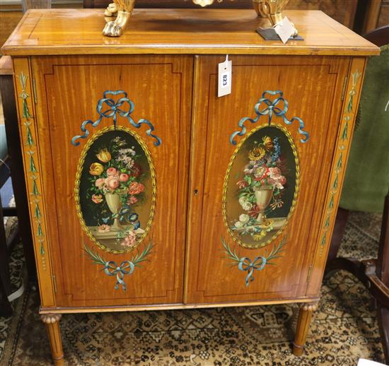 A Sheraton style two door satinwood cabinet W.76cm